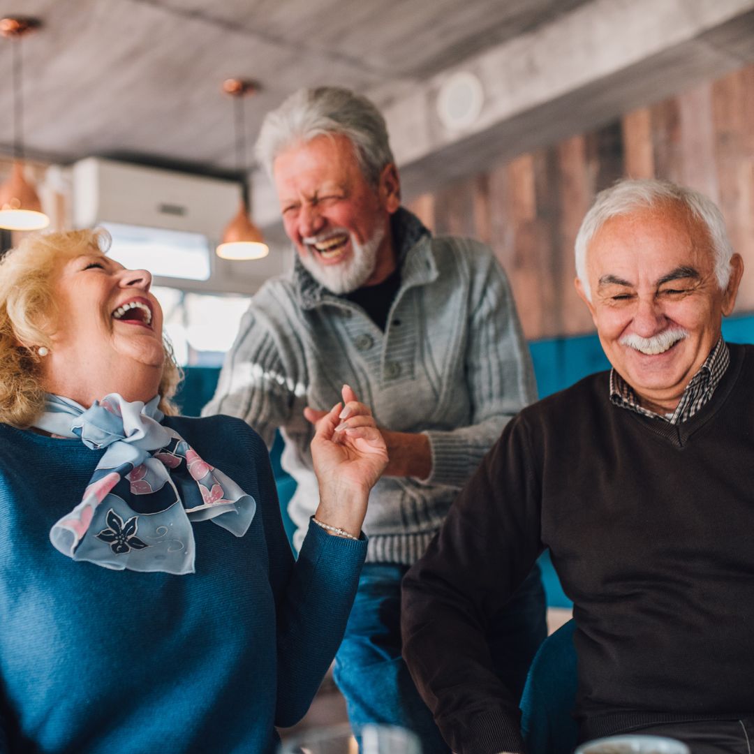 Older friends laughing