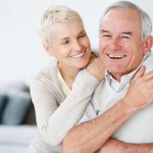 couple smiling and hugging eachotehr