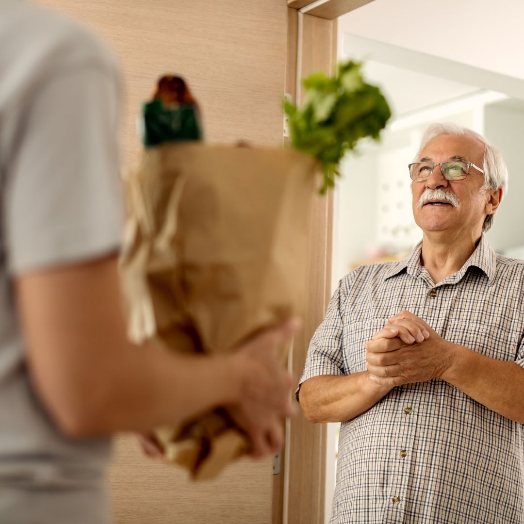 care worker delivering groceries