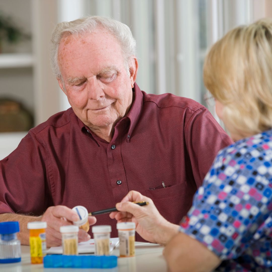 care worker helping with pills