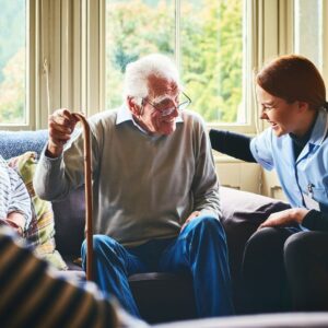 wide view of a nurse laughing with a senior resident