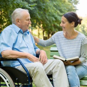 man in a wheelchair with woman