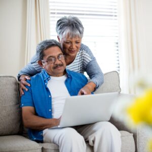 senior couple looking at computer