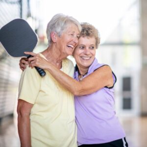 senior ladies playing pickleball