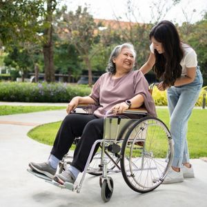 elderly mother in the park with daughter