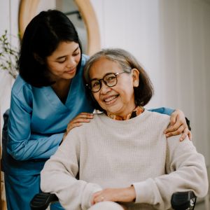 Nurse Taking Care of an Elderly Woman