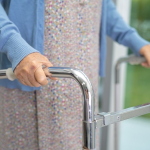 Elderly woman using a walker
