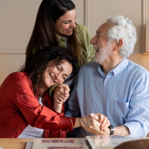 image of a happy family with an aging parent