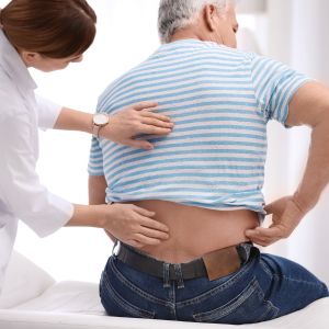A nurse helping a man manage his pain.